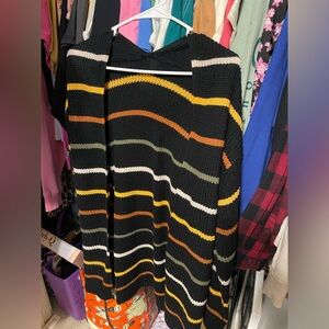 Cardigan, Striped And Long to maybe knees depending on your height.